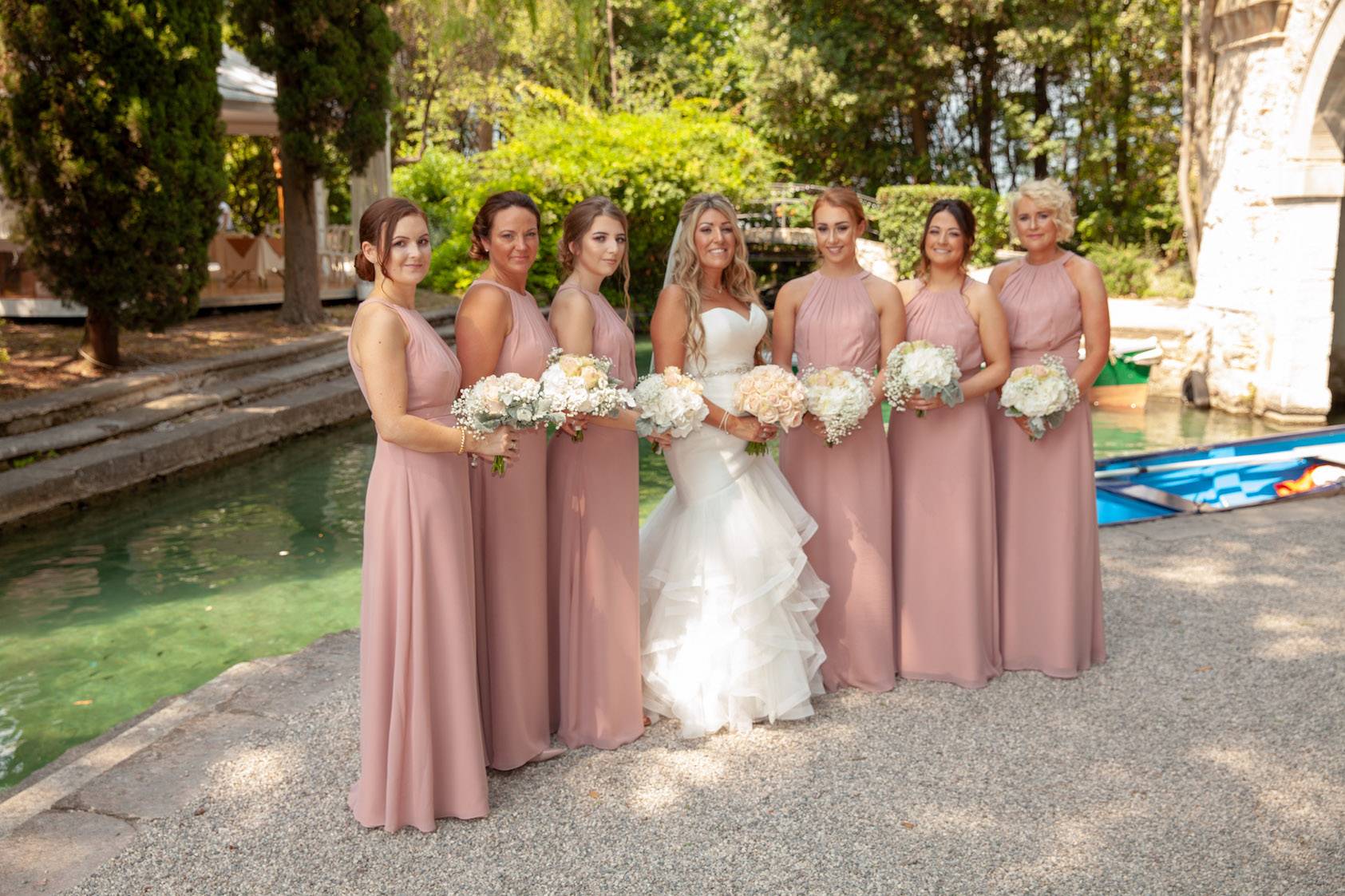 Bride and her bridesmaids at the port on Isola del Garda