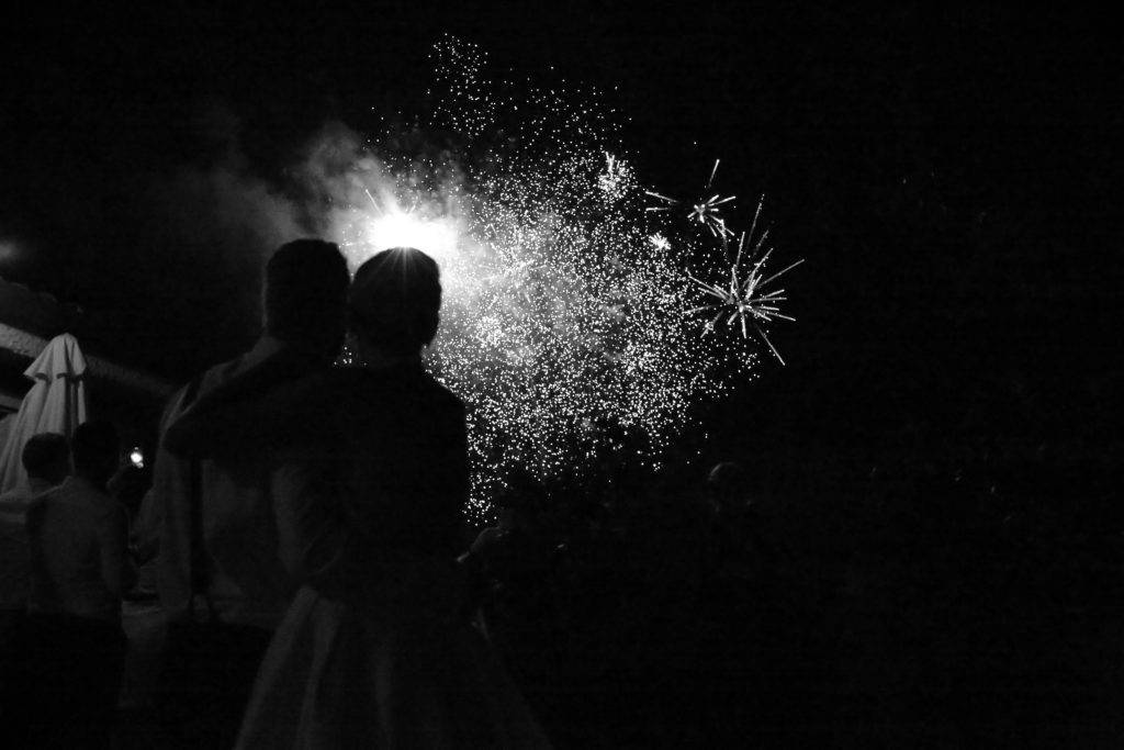 Bride and groom watching fireworks
