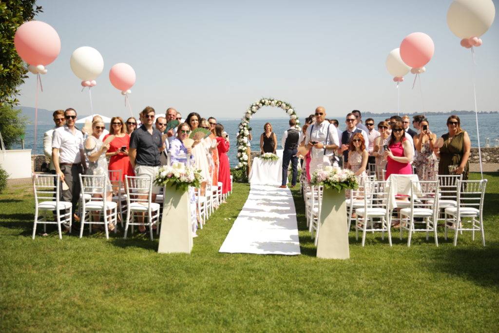 outdoor symbolic wedding ceremony with a view of Lake Garda