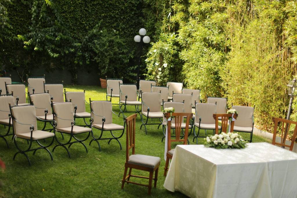 Small wedding ceremony set up in the garden of the Hotel Laurin